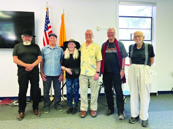 Navy veteran Mike Hibner (left), Daniel J. Bruce, Jasmine Tritten (family member to a soldier), Bill Nevins (family member to a soldier), and Army veteran Chuck Nemeth attended the Southwest Writers event June 10 at McCurdy Ministries.