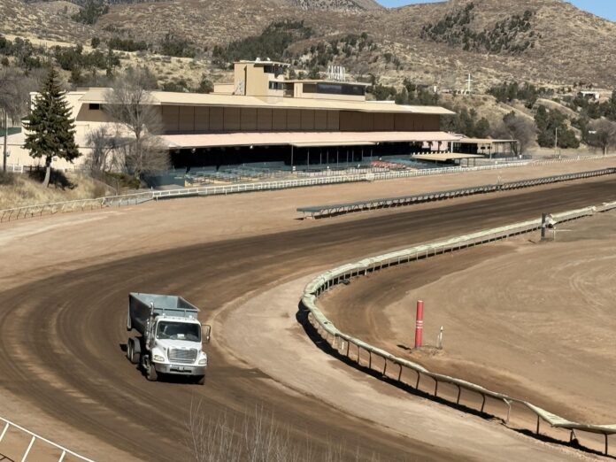 A truck drives through Ruidoso Downs Race Track, Jan. 20, 2026, the day after horse racing was canceled at the track for the 2026 season due to flood damage. Todd Fuqua | Ruidoso News