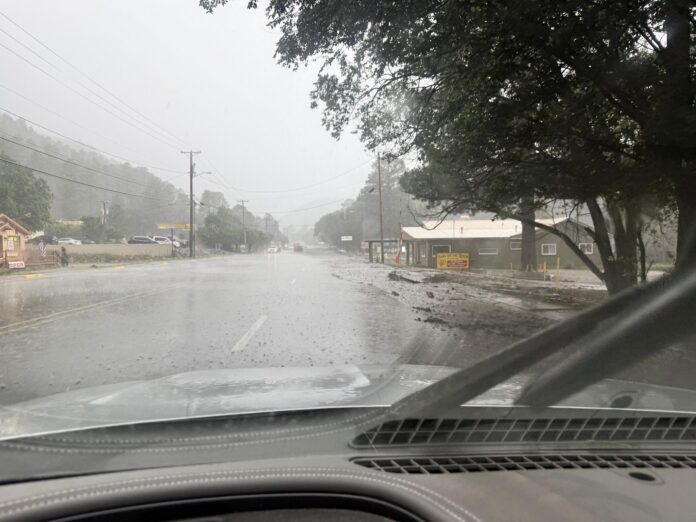 The view from my windshield on July 8 as the first rushing waters of last year’s flood event began overtaking Sudderth Drive.
