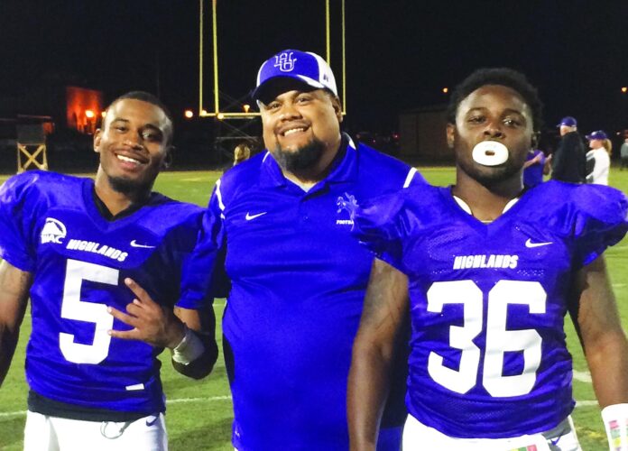 New McCurdy football coach Carlos Perea (center) stands with former New Mexico Highlands players Dion Alston (left) and Dazmon Scott (right), when Perea was the assistant offense coordinator for the Cowboys.