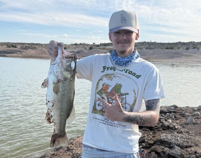 Josiah Tyler Norman landed his personal-best largemouth bass, an 8-pounder, using a white shad lure on July 7, 2026 at Elephant Butte Lake.