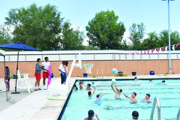 Students escape the heat Aug. 4 at the Splash Bash by swimming in the Ranchitos pool.