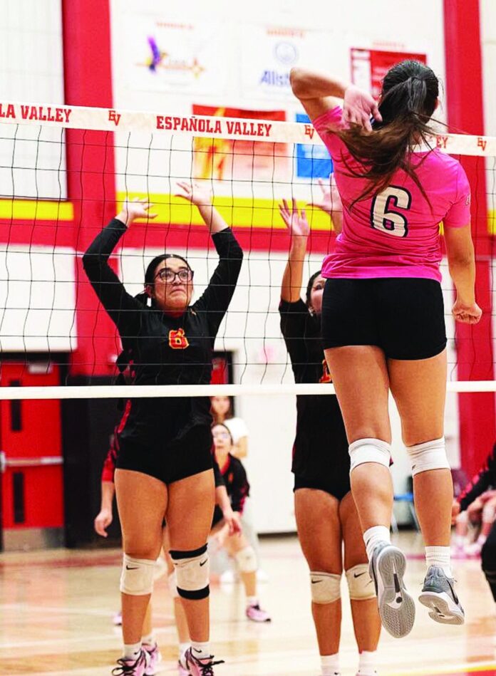 Española Valley junior Aryannah Chavez (6), going up for a block last year against Pojoaque Valley, is being counted on for her experience and her defensive ability.