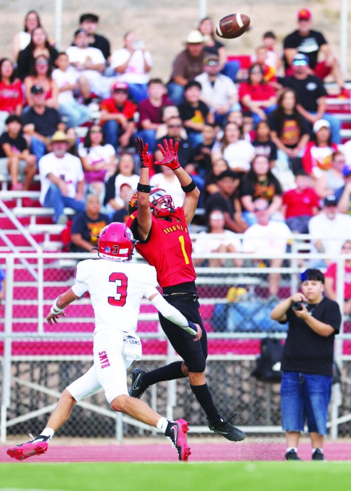 Española Valley wide receiver Benny Trujillo makes a catch Friday during the Sundevils’ 58-6 loss to Portales.